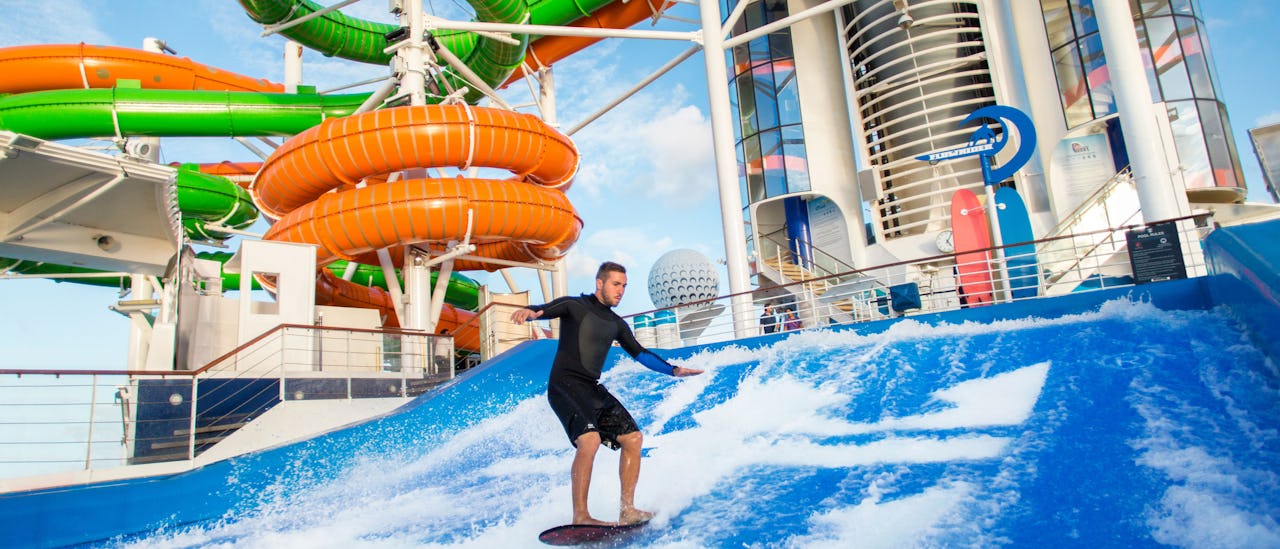 The Flowrider surf simulator with the Perfect Storm waterslide in the background