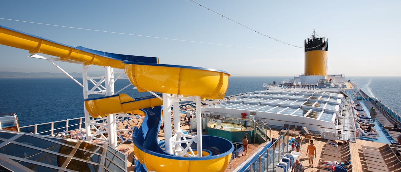 The waterslide towering over the pool deck