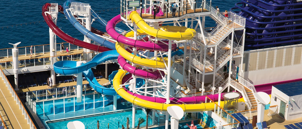 3 water slides over the pool deck