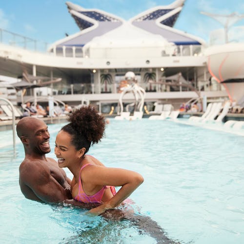 Pool deck on Celebrity Cruises with lounge chairs