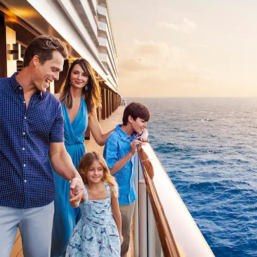 : Family enjoying ocean views from their private balcony stateroom on Norwegian Cruise Line, blending comfort with unforgettable moments at sea