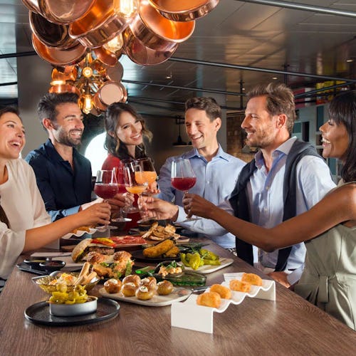 Couple dining at an upscale restaurant onboard MSC Cruises, featuring Mediterranean-inspired cuisine.