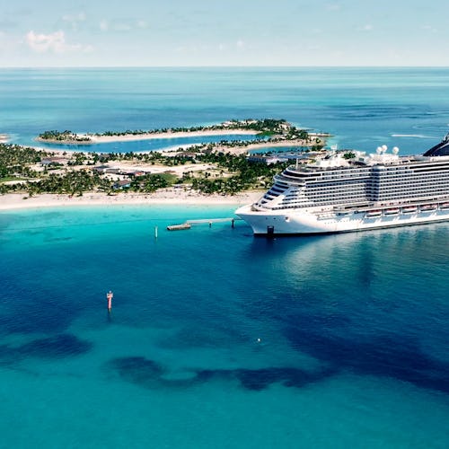 MSC Cruises ship docked at a vibrant international port, offering unforgettable travel experiences.