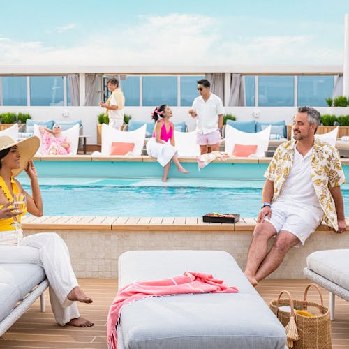 Couple relaxing in The Sanctuary® aboard Princess Cruises, surrounded by peaceful ocean views.
