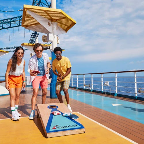 Family playing mini-golf and kids enjoying youth clubs aboard Carnival, designed for cruisers of all ages