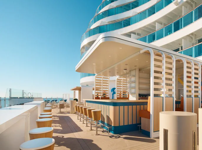 Guests enjoying Costa Cruises’ signature Italian style, surrounded by bold décor and vibrant onboard ambiance.