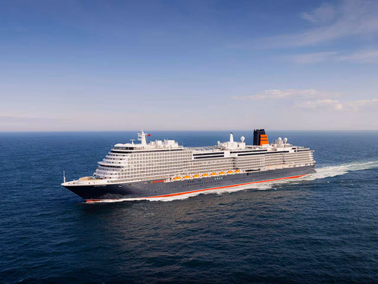Majestic Cunard cruise ship sailing across the ocean, showcasing timeless elegance and iconic British maritime heritage.