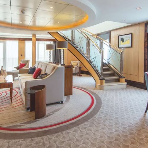 Elegant Cunard suite featuring spacious living areas, refined décor, and ocean views, offering the pinnacle of luxury at sea.